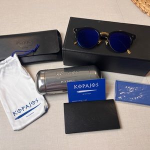 Kopajos sunglasses - Blue lenses, black and gold frame.